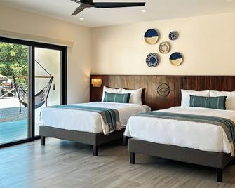 Reunion Hotel and Wellness Center - Las Catalinas - Bedroom