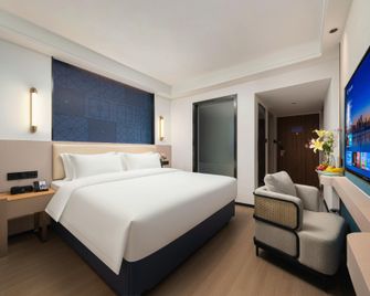 Kyriad Marvelous Hotel Changsha Wuyi Plaza Xiangya - تشانغشا - غرفة نوم