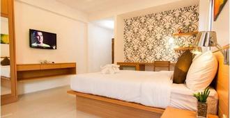 Palmari boutique hotel - Krabi - Schlafzimmer