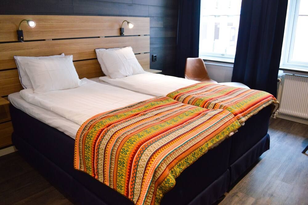 Hotell Stortorget - Östersund - Bedroom