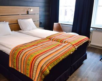 Hotell Stortorget - Östersund - Bedroom