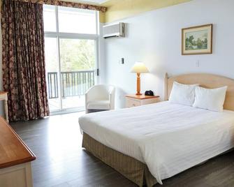 Hôtel au Petit Berger - לה מאלבאי - חדר שינה