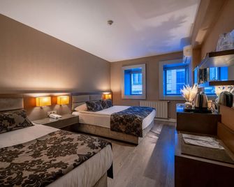 The New Hotel Zeybek - Izmir - Slaapkamer