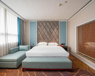 Tiancheng Holiday Hotel (Nanchong Renmin Garden) - Nanchong - Bedroom