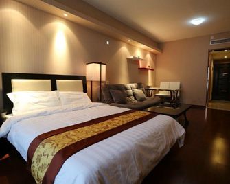 Champs-Élysées Duplex Apartment Hotel (Qingdao Convention and Exhibition Center Branch) - Qingdao - Bedroom