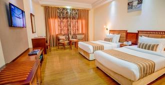Hamdan Plaza Hotel - Salala - Schlafzimmer