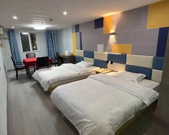 7 Days Sunshine Chibi Train Station Branch - Xianning - Bedroom