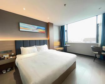 7 Days Inn Hanzhong Tianhan Avenue South Station Branch - Hanzhong - Slaapkamer