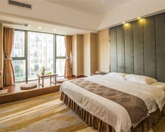 Created Ashton Business Hotel - Wuzhou - Slaapkamer