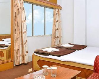 Hotel Yashoda International Deoghar - דאוגהאר סאדאר - חדר שינה