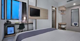 Hotel Neo Gajah Mada Pontianak By Aston - Pontianak - Slaapkamer