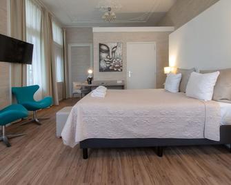 Hotel Andante aan Zee - האג - חדר שינה