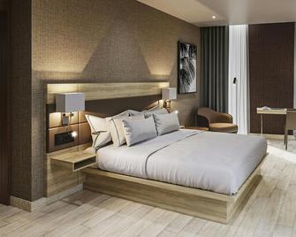 AC Hotel by Marriott Santiago de los Caballeros - Santiago de los Caballeros - Schlafzimmer