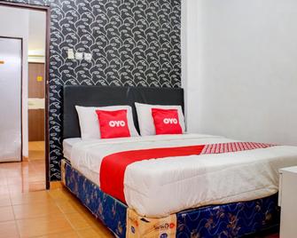 OYO 3855 Homestay Semata Wayang Syariah - Martapura - Habitación