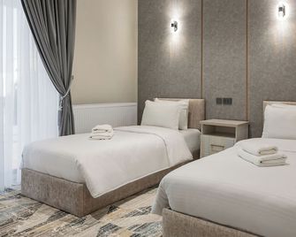 Hotel Shodlik - Samarqand - Schlafzimmer