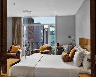 كنج آند كوين هوتل سويتس - نيو بليموث - غرفة نوم