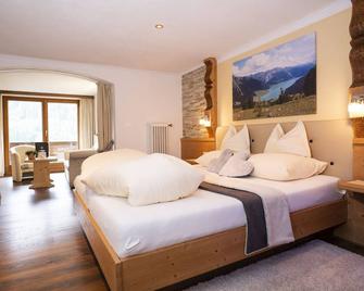 Beauty & Wellness Hotel Tirolerhof - Nauders - Schlafzimmer