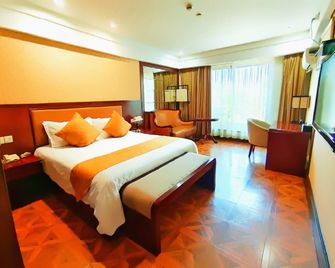 Linjiang International Cruise Hotel (Shanghai Youyi Road) - شنغهاي - غرفة نوم