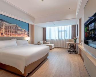 Xin Da Zhou Hotel - שנג'ן - חדר שינה