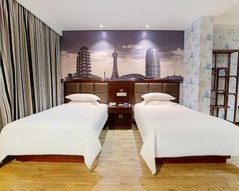 Shell Hotel (Xinxiang Pang Donglai Branch) - Xinxiang - Bedroom