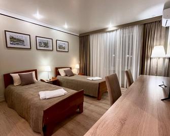 Viatskiye Ulochki Centr Guest House - Kirov - Bedroom