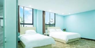 Kong Yi Hotel - Haikou Airport Branch - Haikou - Bedroom