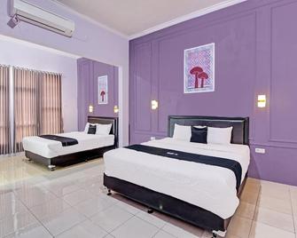Capital O 92250 Hall & Guesthouse Kowapi Syariah - Purwokerto - Bedroom