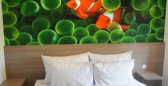 Top Hotel Manado - Manado - Schlafzimmer