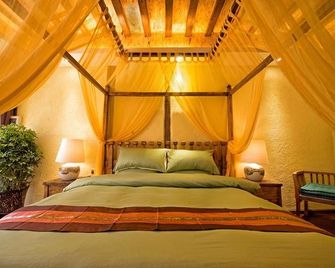 Ruijingna Boutique Inn - ליז'יאנג - חדר שינה