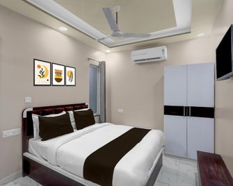 Spot On Hotel Yamnotri - Prayagraj - Schlafzimmer
