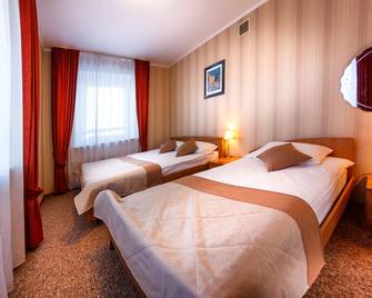 Onega Hotel - Chabarowsk - Schlafzimmer