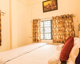 On The Ghat By Howdy Hostels - Varanasi - Camera da letto
