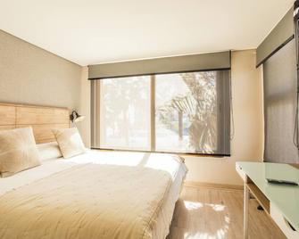 Hotel Canto del Mar - לה סרנה - חדר שינה