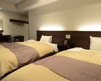 Hotel New Mifuku - Koka - Slaapkamer