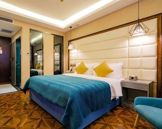 Caring Fere Hotel (Xi'an Library Metro Station) - Xi'an - Habitación