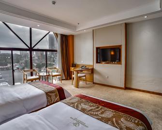 Golden Apple Hot Spring Hotel - Ан-Шун - Спальня