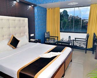 Hotel Rajhans International - Bhāgalpur - Bedroom