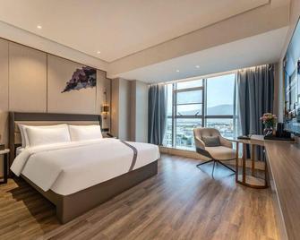 Elong Hotel (Zhaoqing Qixingyan Archway Plaza) - Zhaoqing - Camera da letto