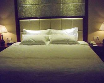 Ming Ren Hotel - Liuzhou - Schlafzimmer