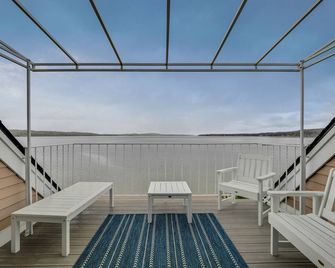 Condo with Lake Charlevoix Views | Private Beach Access | Gas Log Fireplace - Boyne City - Balcony