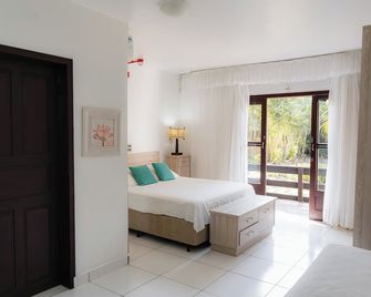 Pousada Porto Dos Casais - Praia do Rosa - חדר שינה