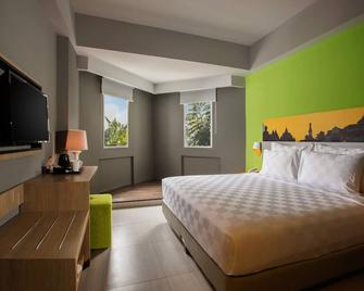 Khas Malioboro Hotel - Yogyakarta - Schlafzimmer