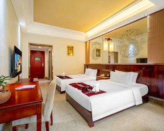 Crown Hotel - Xishuangbanna - Ložnice