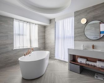 Lanou Hotel Xishuangbanna Jinghong Gaozhuang - Xishuangbanna - Schlafzimmer