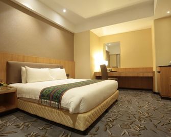 إمبريال ريفر بانك هوتل كاتشينج - كوتشينغ - غرفة نوم