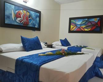 Hotel Tumburagua Inn Ltda - Neiva - Schlafzimmer