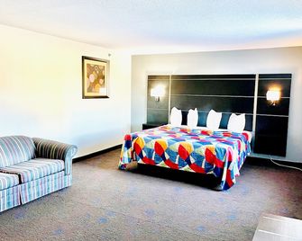 Coratel Inn and Suites by Jasper Northfield - Northfield - Slaapkamer