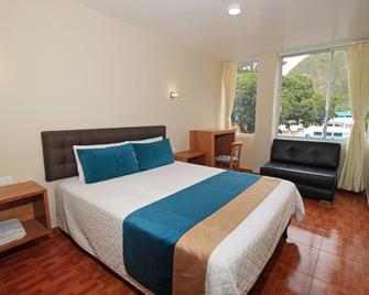 Hostal Plaza by Elvita - Baños de Agua Santa - Habitación