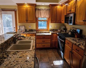 Cozy and fully renovated 4-bedroom rental property, available for you to enjoy. - Gilford - Kitchen