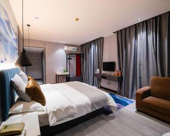 Ledao Business Hotel - Liuzhou - Спальня
